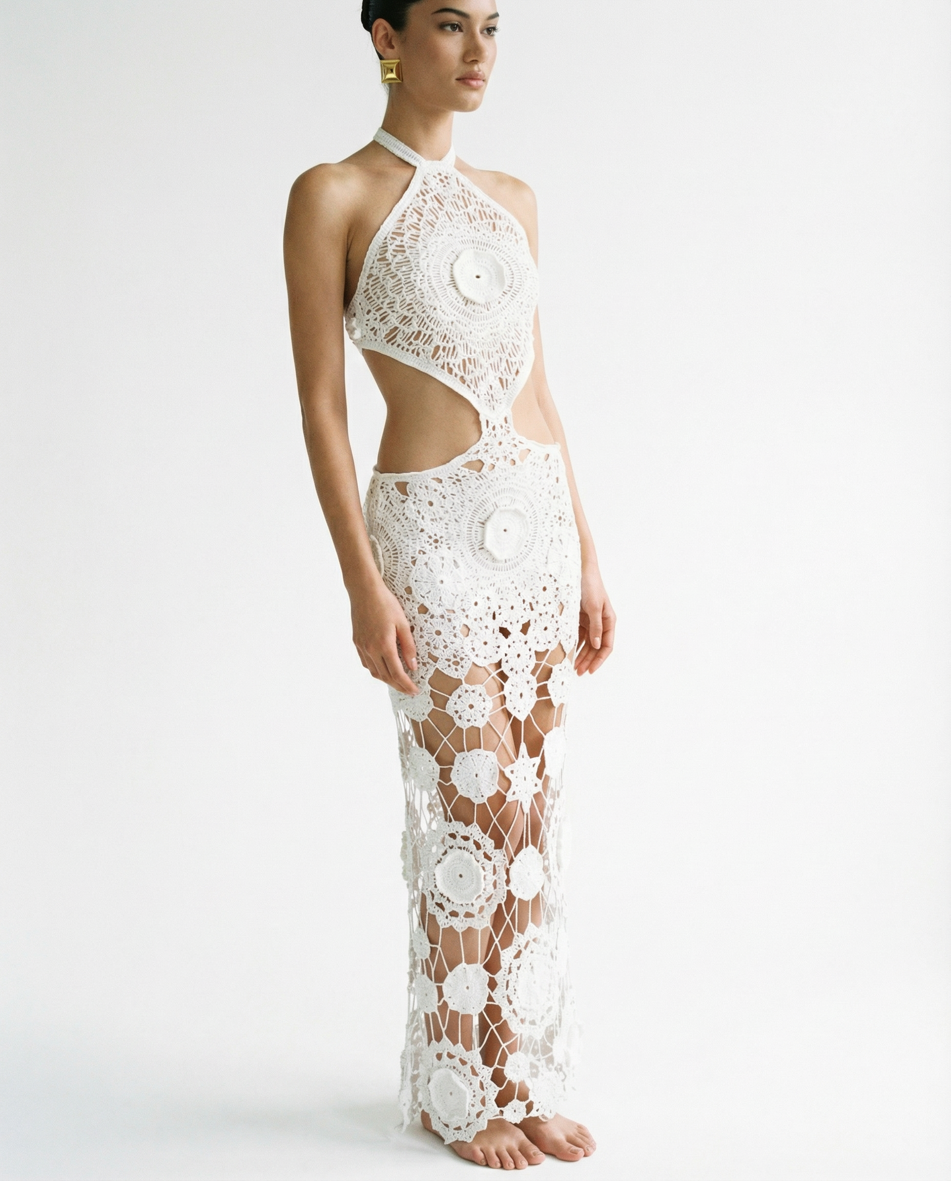 White lace halter neck dress on a model against a white background